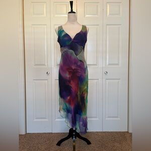 Cartise sleeveless dress with asymmetrical hem. Size 4